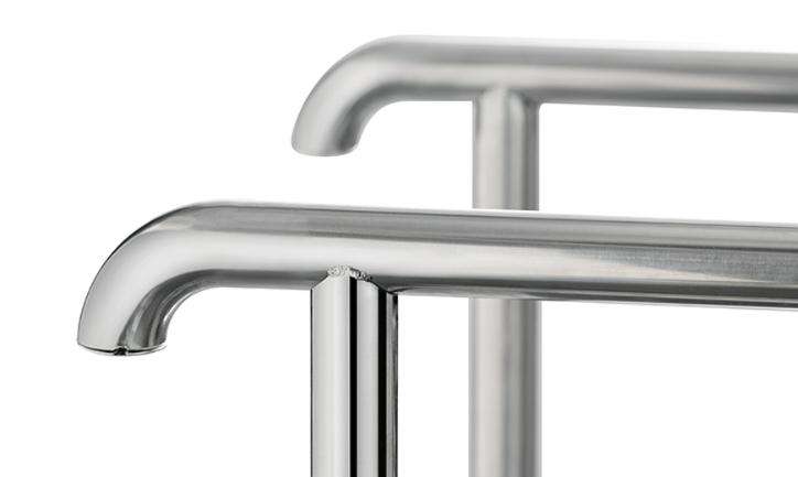 Curved handrails of industrial shoe cleaning equipment