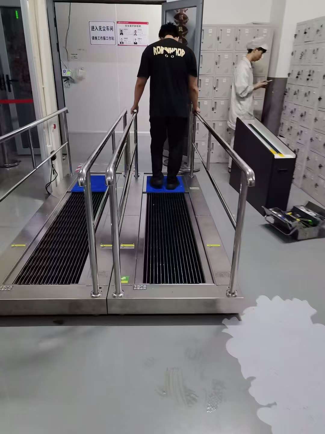 the electric shoe cleaner machine at the workshop entrance